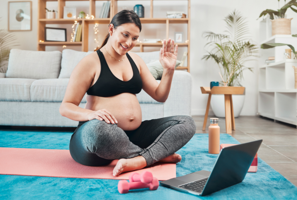pregnant mom working out with trainer