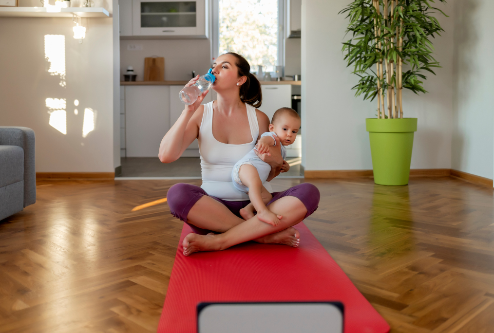 postpartum mom working out with her baby