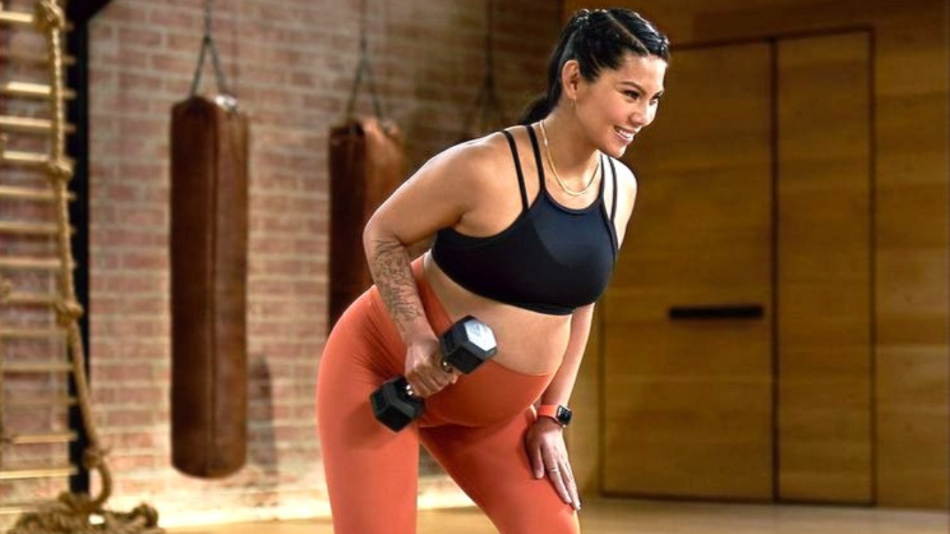pregnant woman exercising under the guidance of her prenatal fitness trainer and birth doula beth colucci foppiano